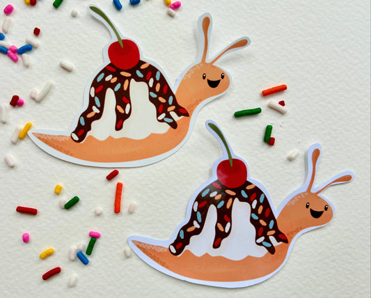 two snail stickers with ice cream sundae shells that have sprinkles and a cherry on top. 